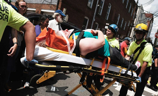 Rescue workers transport a victim who was injured when a car drove through a group of counter protesters at the "Unite the Right" rally Charlottesville, Virginia, U.S., on Saturday. (REUTERS)