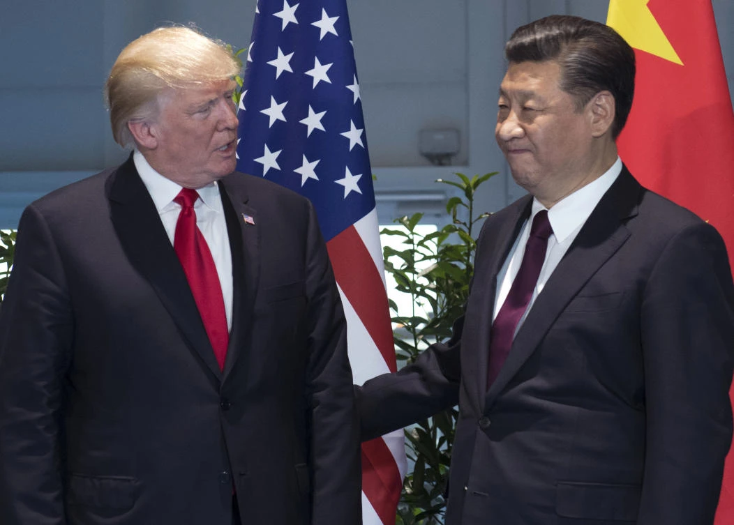 In this July 8, 2017, file photo, U.S. President Donald Trump, left, and China's President Xi Jinping arrive for a meeting on the sidelines of the G-20 Summit in Hamburg, Germany. Trump is planning to sign an executive action asking the U.S. Trade Representative to consider investigating China for the theft of U.S. technology and intellectual property. He is taking the step even as he seeks China’s help with the ongoing crisis with North Korea. (AP)