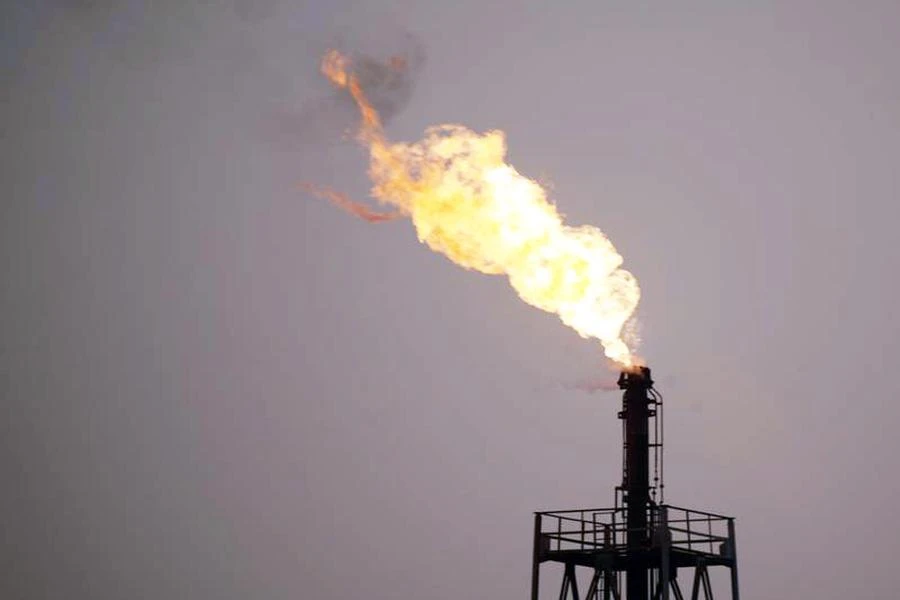 Above, flames rise from an oil refinery in Cairo. (Reuters)