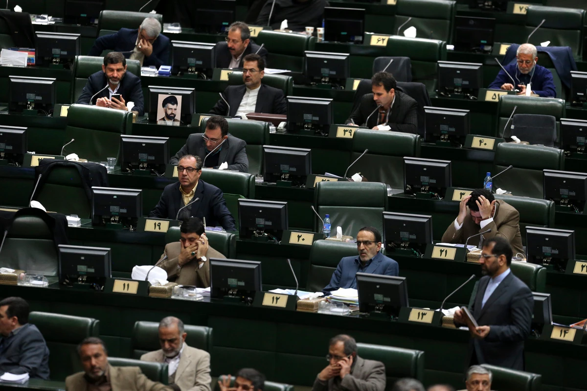 In this photo taken on Sunday, Feb. 19, 2017, lawmakers attend an open session of the Iranian parliament in Tehran, Iran. Iran's parliament voted overwhelmingly Sunday, Aug. 13, to increase spending on its ballistic missile program and the foreign operations of its paramilitary Revolutionary Guard, chanting "Death to America" in a direct challenge to Washington's newest sanctions on the Islamic Republic. (AP)