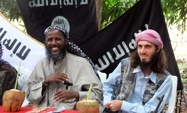 Mukhtar Robow Abu Mansur, left, speaks to media in Mogadishu, Somalia, in this file photo. (AP)