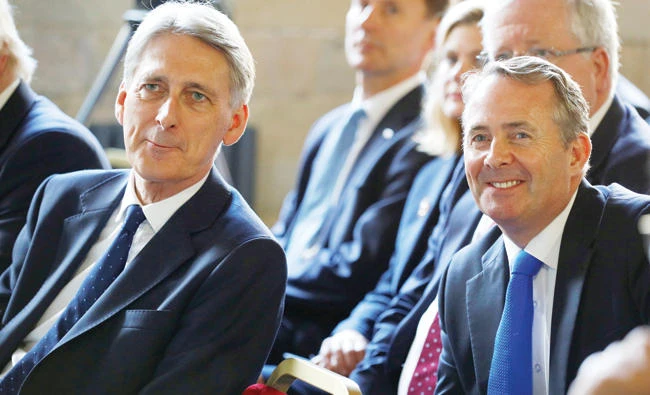 Britain’s Chancellor of the Exchequer Philip Hammond with Secretary of State for International Trade Liam Fox at Prime Minister Theresa May’s election manifesto launch in Halifax, Britain, on May 18. (Reuters)