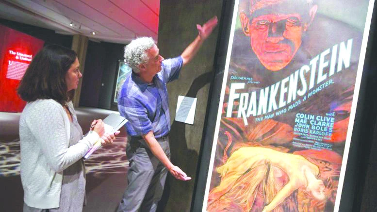 Curator Daniel Finamore, center, speaks with a reporter at the Peabody Essex Museum in Salem, Mass. (AP)