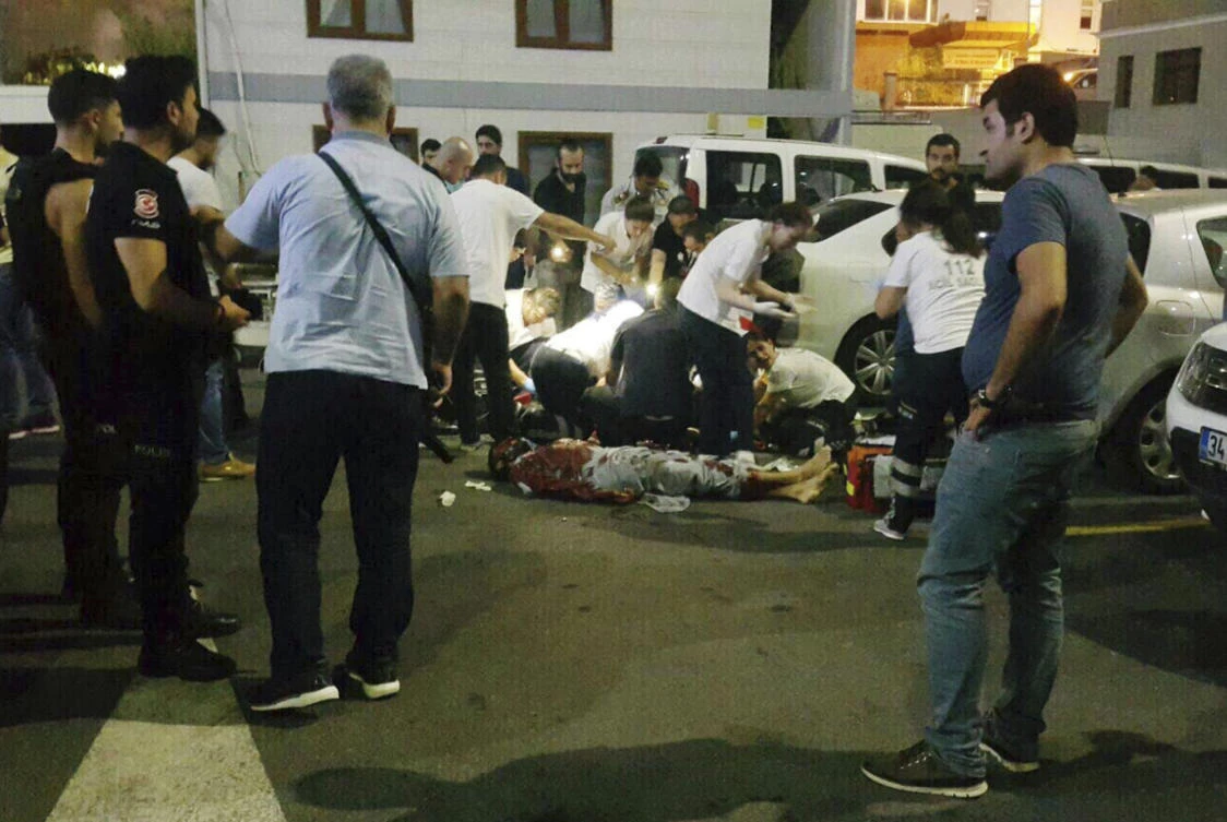 EDS NOTE: GRAPHIC CONTENT - In this image made from video, police gather at the scene of an attack in Istanbul, late Sunday, Aug. 13, 2017. Turkey's official news agency says a man suspected of being a suicide bomber for the Islamic State group has stabbed and killed a police officer while in custody. Anadolu Agency reported that police detained a man thought to be planning a bomb attack on behalf of IS. The suspect was taken to Istanbul police headquarters, where police say he attacked an officer with a knife. The officer died. The man was shot and killed in the attack. (AP)