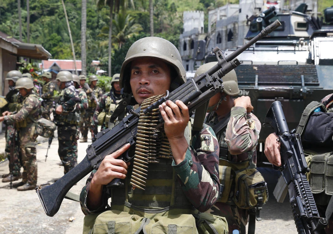 Battles between Philippine extremists, govt-backed separatists kill 25