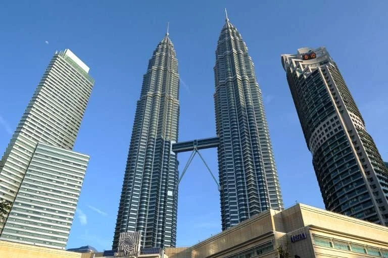 The Petronas Towers, also known as the Petronas Twin Towers, are twin skyscrapers in Kuala Lumpur, Malaysia. (AFP)