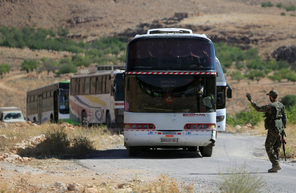 Fighters, refugees leave Lebanon enclave for Syria