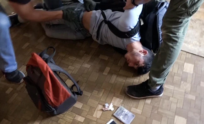 In this undated video grab, Russian FSB officers arrest a man on suspicion of plotting a series of attacks outside Moscow. (AP)
