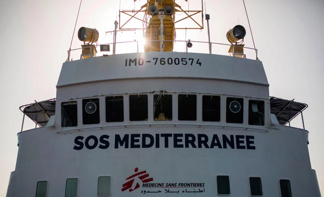 This picture taken on August 11, 2017, shows the Aquarius rescue ship of the European search and rescue association "SOS Mediterranee" during a search operation on the Mediterranean Sea, not far from the Libyan coast. (AFP / Angelos Tzortzinis)