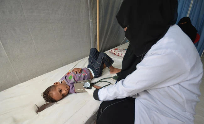A nurse attends to a boy infected with cholera at a hospital in Hodeidah, Yemen. (Reuters)