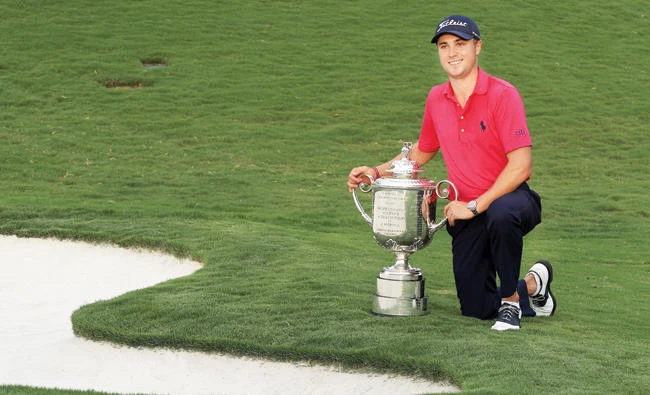 Justin Thomas of the US poses with the Wanamaker Trophy after winning the 2017 PGA Championship during the final round at Quail Hollow Club on Sunday in Charlotte, North Carolina. (AFP)