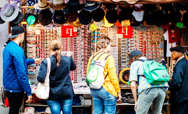 Signs display the price in pounds sterling of goods displayed for sale on a stall at Portobello Road Market in the Notting Hill district of west London, in this August 8, 2017 photo. (AFP)