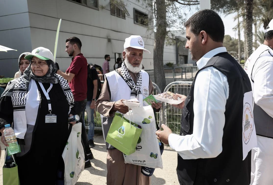Palestinian Muslim pilgrims arrive at the Rafah border crossing between Egypt and the southern Gaza Strip, on Monday, ahead of their departure to the annual Hajj pilgrimage in Saudi Arabia's holy city of Makkah. (AFP / Said Khatib)