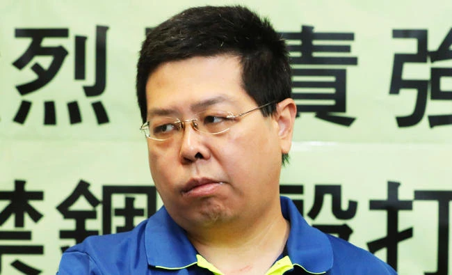 Democracy party member Howard Lam displays a photo of soccer star Lionel Messi during a press conference in Hong Kong, in this Aug. 11, 2017 photo. (AP)
