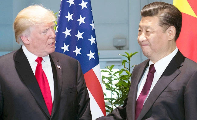 In this July 8, 2017 photo, U.S. President Donald Trump, left, and Chinese President Xi Jinping arrive for a meeting on the sidelines of the G-20 Summit in Hamburg, Germany. (AP)