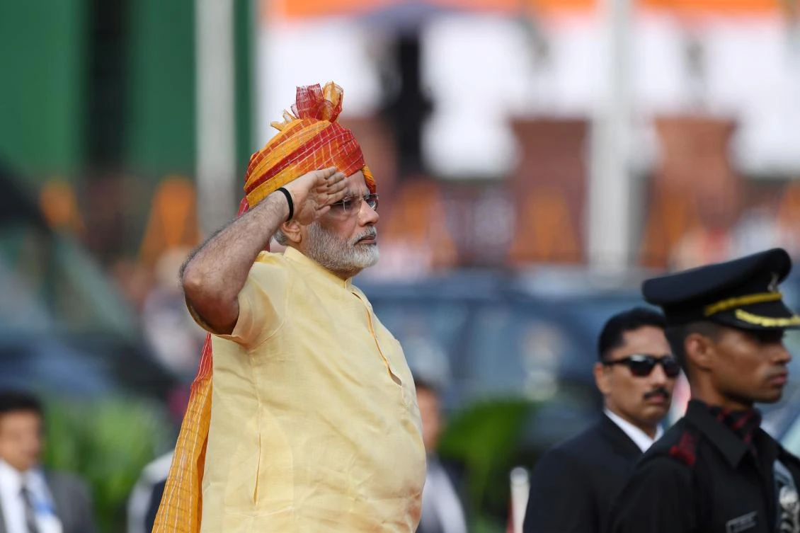 Indian Prime Minister Narendra Modi salutes a guard of honour during the country's 71st Independence Day celebrations, which marks the 70th anniversary of the end of British colonial rule, at the historic Red Fort in New Delhi on August 15, 2017. India can defend itself from anyone who seeks "to act against our country", Prime Minister Narendra Modi said in an Independence Day speech August 15 amid a tense standoff with Beijing over a Himalayan plateau. / AFP / PRAKASH SINGH