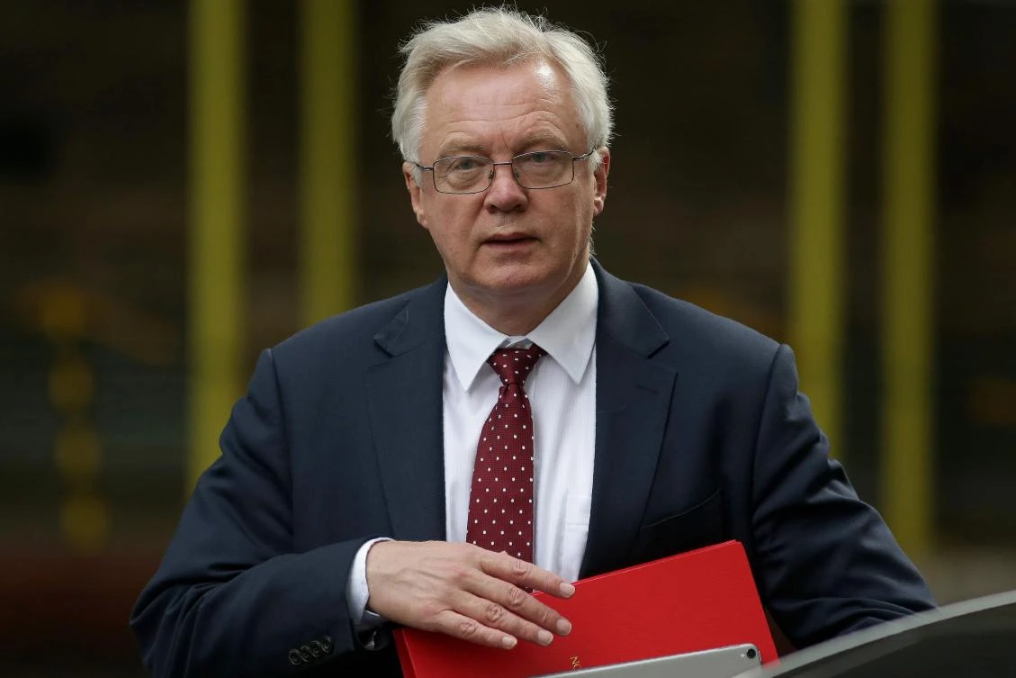 (FILES) This file photo taken on July 19, 2017 shows Britain's Secretary of State for Exiting the European Union (Brexit Minister) David Davis arrives in Downing Street in central London. Britain will seek a "temporary customs union" with the European Union after Brexit, the government said Tuesday as it prepared to publish its first detailed proposals on the future partnership. Davis told BBC radio on August 15, 2017, that the transition period could last "something like two years" and would have to be over by the time of the next general election, which is set for 2022. (AFP)