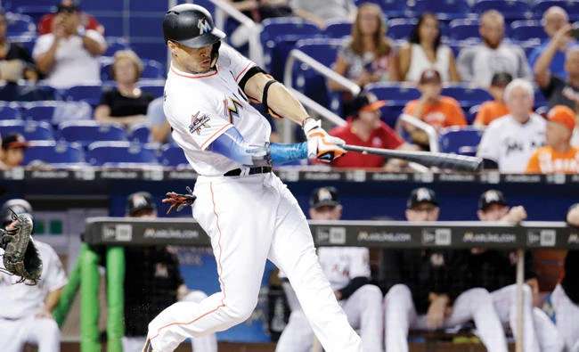 Miami Marlins’ Giancarlo Stanton hits a two-run home run during the first inning of a baseball game against the San Francisco Giants Monday in Miami. (AP)
