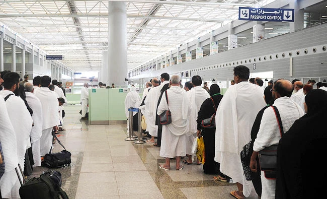 Muslim pilgrims wait to pass security as the first pilgrims for the annual Hajj pilgrimage arrive in Jeddah, in this file photo. (AFP)