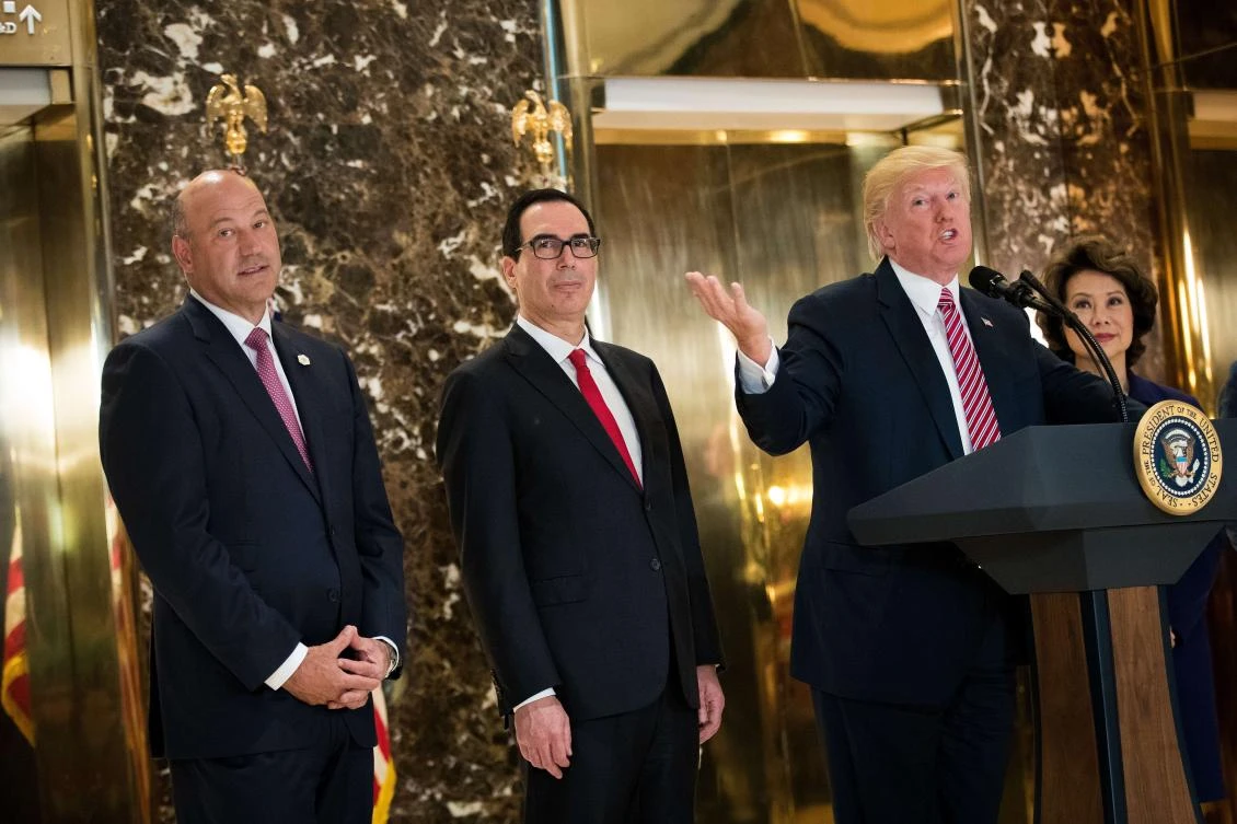 President Donald Trump delivers remarks following a meeting on infrastructure at Trump Tower on Tuesday in New York City. Standing alongside him from L to R, Director of the National Economic Council Gary Cohn, Treasury Secretary Steve Mnuchin, and Transportation Secretary Elaine Chao. He fielded questions from reporters about his comments on the events in Charlottesville, Virginia and white supremacists. (Drew Angerer/Getty Images/AFP)
