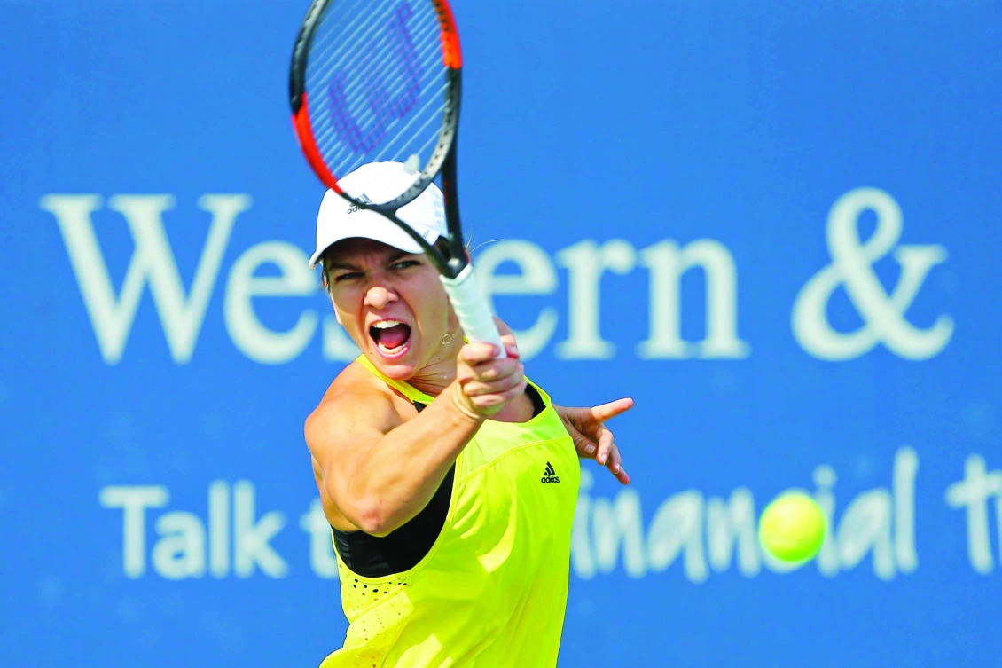 Simona Halep of Romania returns a shot against Taylor Townsend of the US during the Western and Southern Open Tuesday at Lindner Family Tennis Center. (USA TODAY Sports)