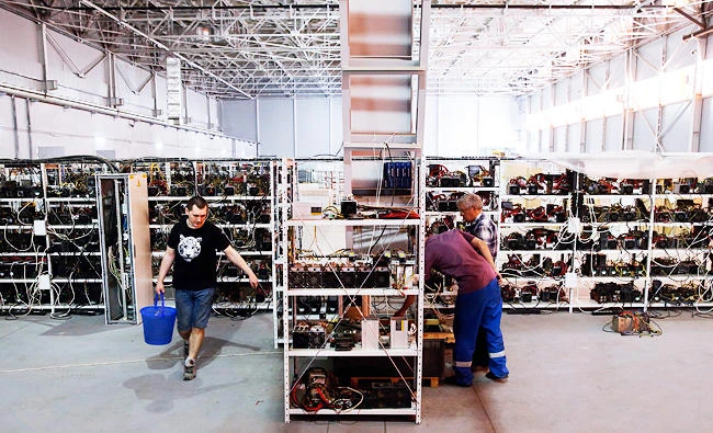 Russia’s crypto-businessman Dmitry Marinichev’s virtual currencies mining farm operates in a former Soviet-era car factory warehouse in Moscow, pictured on July 26, 2017. (AFP)