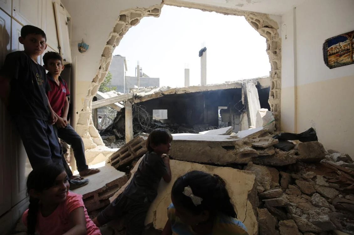 Children check the house of a Palestinian man, who took part in an attack in Jerusalem in which an Israeli policewoman was killed, after it was destroyed by Israeli authorities in the village of Deir Abu Mashal, near Ramallah, in the occupied West Bank, on August 17, 2017. Israel regularly demolishes the homes of Palestinian attackers, calling it a deterrent against future violence. However, human rights groups say it amounts to collective punishment, with family members forced to suffer for the acts of relatives. (AFP)