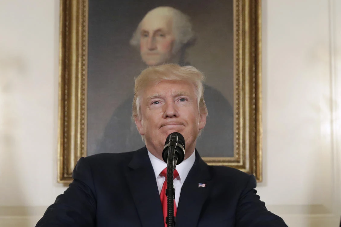 In this Aug. 14, 2017, photo, President Donald Trump pauses while speaking in the Diplomatic Reception Room of the White House in Washington. Is it really so far-fetched to put Robert E. Lee in the same category as George Washington, as President Donald Trump suggested Tuesday? Many historians say yes. (AP Photo/Evan Vucci, File)