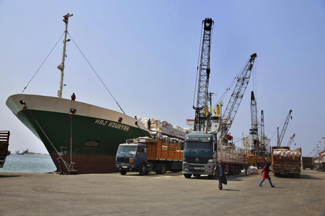 In this Wednesday, Aug. 9, 2017 photo, cranes offload hay from a ship onto waiting trucks in the port of the northern city of Tripoli, Lebanon. Markets across the Middle East are anticipating a mammoth reconstruction boom in Syria that could stimulate billions of dollars in economic activity, and Lebanon, as Syria’s neighbor, is in prime position to capture a share of that reward.(AP Photo/Bilal Hussein)