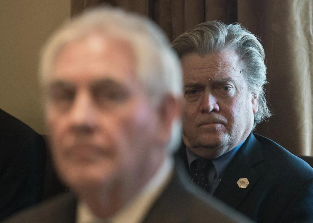 (FILES) This file photo taken on March 13, 2017 shows Senior White House advivor Steve Bannon as US President Donald Trump (out of frame) speaks to the press before a meeting with his cabinet at the White House in Washington, DC. White House strategist Steve Bannon argued forcefully in an interview published Wednesday, August 16, 2017, that the United States is in an "economic war" with China, and the confrontation with nuclear-armed North Korea is just "a sideshow." "To me the economic war with China is everything. And we have to be maniacally focused on that," he said in the interview with the American Prospect, a left-leaning website. Bannon, an economic nationalist and former CEO of the extreme-right Breitbart news website, is reported to be on shaky ground with President Donald Trump, who gave him only a tepid endorsement this week. (AFP)
