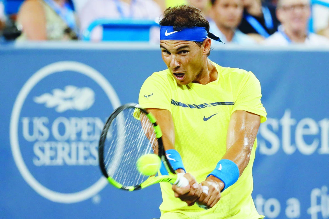 Rafael Nadal, of Spain, returns to Richard Gasquet, of France, during their middle match at the Western & Southern Open tennis tournament Wednesday in Mason, Ohio. (AP)