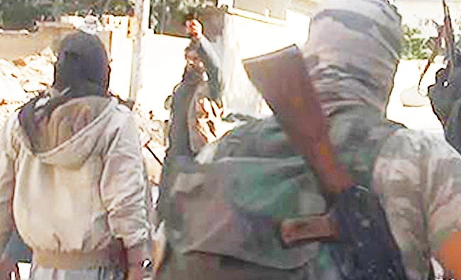 This undated file photo posted on Nov. 4, 2014 by the Raqqa Media Office of the Daesh group, shows Daesh group fighters in Kobani, Syria. (AP)