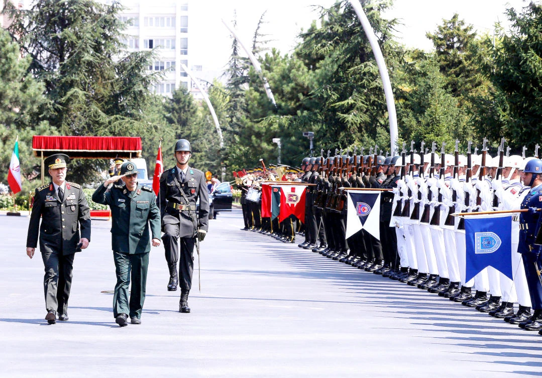 Turkish military Chief of Staff Hulusi Akar and his Iranian counterpart Gen. Mohammed Baqeri review the guard of honor during a welcoming ceremony in Ankara. (Reuters)