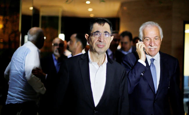Lebanese Minister of Industry Hussein Hajj Hassan, left, in Damascus. (Reuters)