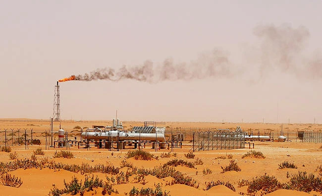 A file photo taken on June 23, 2008 shows a flame from a Saudi Aramco oil installation known as "Pump 3" seen in the desert near the oil-rich area of Khouris, 160 kms east of the Saudi capital Riyadh. (AFP)