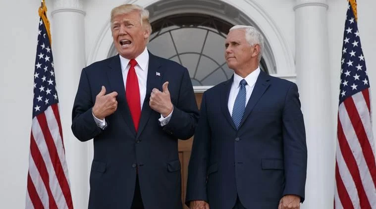 In this August 10, 2017, President Donald Trump, accompanied by Vice President Mike Pence, speaks to reporters before a security briefing at Trump National Golf Club in Bedminster, N.J. (File photo by AP)