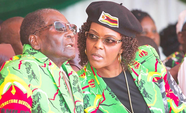 In this June, 2, 2017 photo Zimbabwean President Robert Mugabe, left, and his wife Grace follow proceedings during a youth rally in Marondera Zimbabwe. (AP)