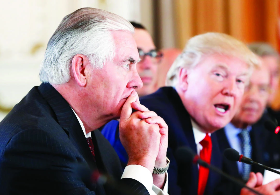In this file photo, US Secretary of State Rex Tillerson listens as President Donald Trump speaks at Mar-a-Lago in Palm Beach, Fla. (AP)