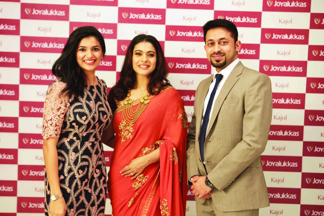 From left, Sonia Alukkas, director of Joyalukkas Group, Indian actress Kajol Devgan, and John Paul Alukkas, executive director of Joyalukkas Group.