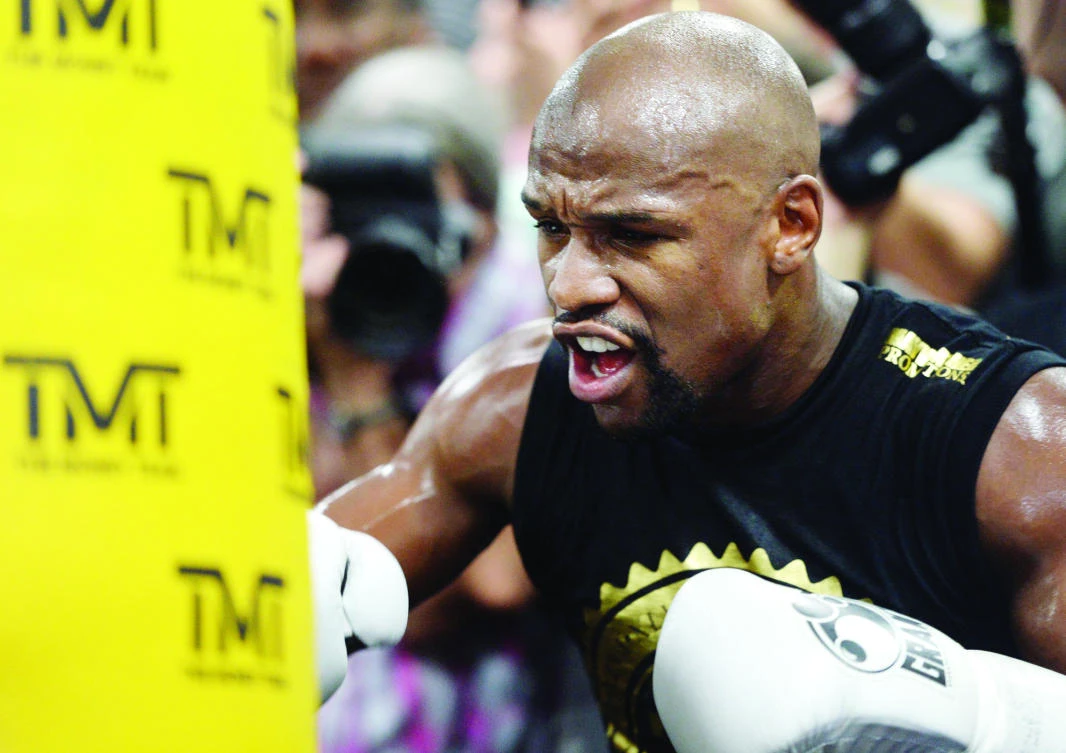 Floyd Mayweather Jr. hits a heavy bag during a media workout in preparation for his fight against Conor McGregor at Mayweather Boxing Club in Las Vegas. (USA TODAY Sports)