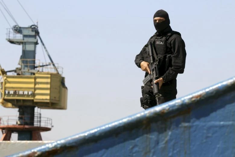A member of the Greek coast guard special forces is seen onboard the “Haddad 1” freighter. (File photo by Reuters)
