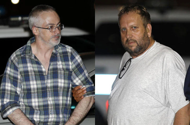 Wyndham Lathem, left, and Andrew Warren arrive at a police station in Chicago, on Aug. 19, 2017. (AP)