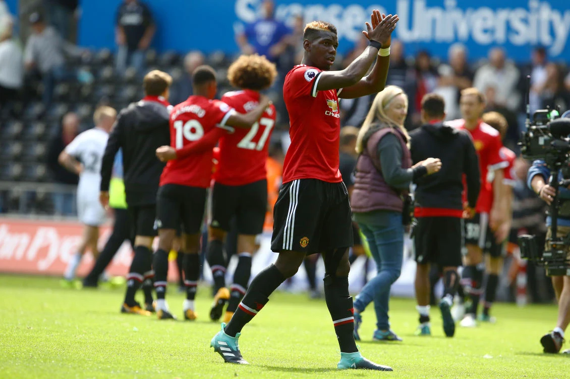 Manchester United’s French midfielder Paul Pogba celebrates victory after the English Premier League football match between Swansea City and Manchester United, on August 19, 2017. (AFP)
