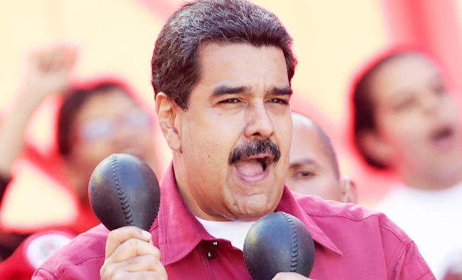 Venezuela's President Nicolas Maduro plays the maracas during a rally against U.S President Donald Trump in Caracas, Venezuela, in this August 14, 2017 photo. (REUTERS)