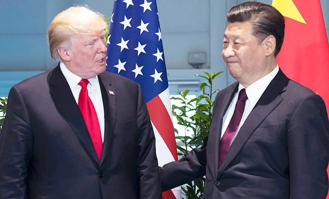 In this July 8, 2017 photo, U.S. President Donald Trump, left, and China's President Xi Jinping arrive for a meeting on the sidelines of the G-20 Summit in Hamburg, Germany. (AP)