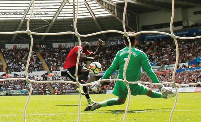 Manchester United’s Romelu Lukaku scores their second goal against Swansea City. (Reuters)