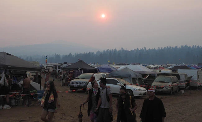 Smoke from nearby wildfires makes for a colorful sunset at the Oregon Eclipse Festival, on Friday, at Big Summit Prairie ranch in Oregon's Ochoco National Forest near the city of Mitchell. (AFP)