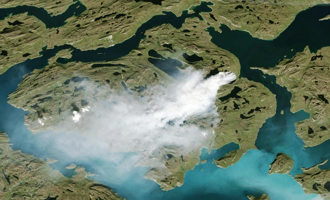 This NOAA handout satellite photo taken on August 3rd, 2017 shows a cloud of smoke from wildfires burning in western Greenland, about 150 kilometers northeast of Sisimiut. (AFP)