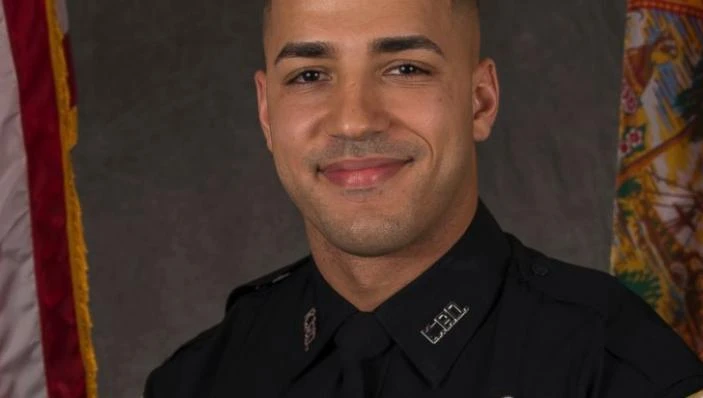 This undated photo from the Kissimmee Police Department shows Officer Matthew Baxter. On Saturday, Aug. 19, 2017, officials said Officers Sam Howard and Baxter were checking suspicious people in an area of Kissimmee, Fla., known for drug activity when they were shot and did not have an opportunity to return fire Friday night. (Kissimmee Police Department/Orlando Sentinel via AP)