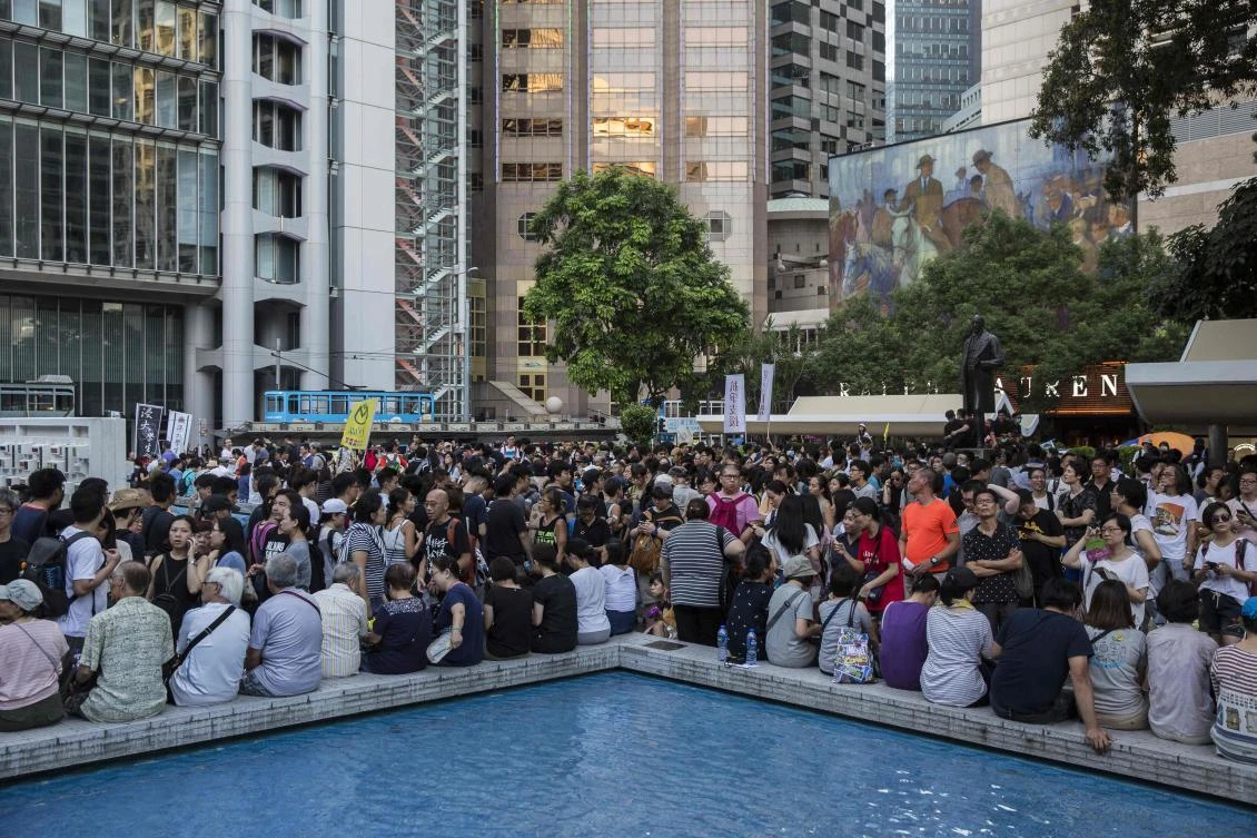 Protesters gather at Statue Square to protest the jailing of Joshua Wong, Nathan Law and Alex Chow, the leaders of Hong Kong’s ‘Umbrella Movement’, on August 20, 2017. (AFP)